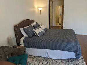 Large master with vaulted ceiling and en suite bathroom