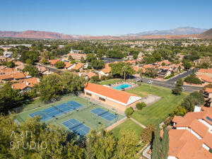 Aerial view of pickleball, tennis, clubhouse and pool