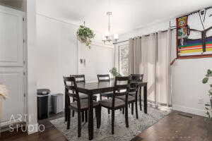 Dining room featuring a chandelier and dark wood finished floors