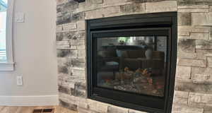 Detailed view of wood finished floors and baseboards