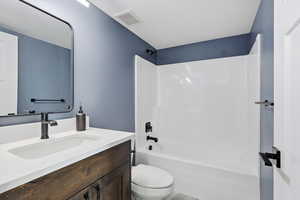 Bathroom featuring shower / bathtub combination and vanity