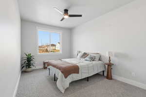 Bedroom featuring light carpet and ceiling fan