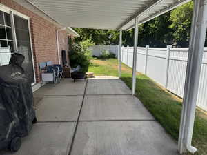 Fenced backyard featuring a patio area