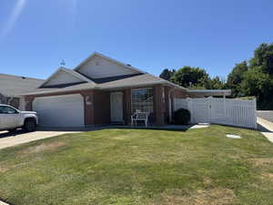 Single story home with an attached garage, concrete driveway, brick siding, and roof with shingles