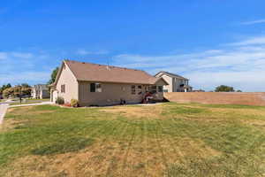 Rear view of property with an attached garage