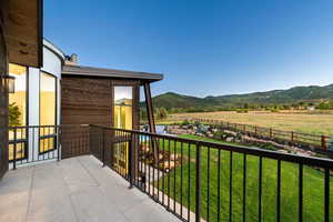 Balcony with a mountain view and a view of countryside