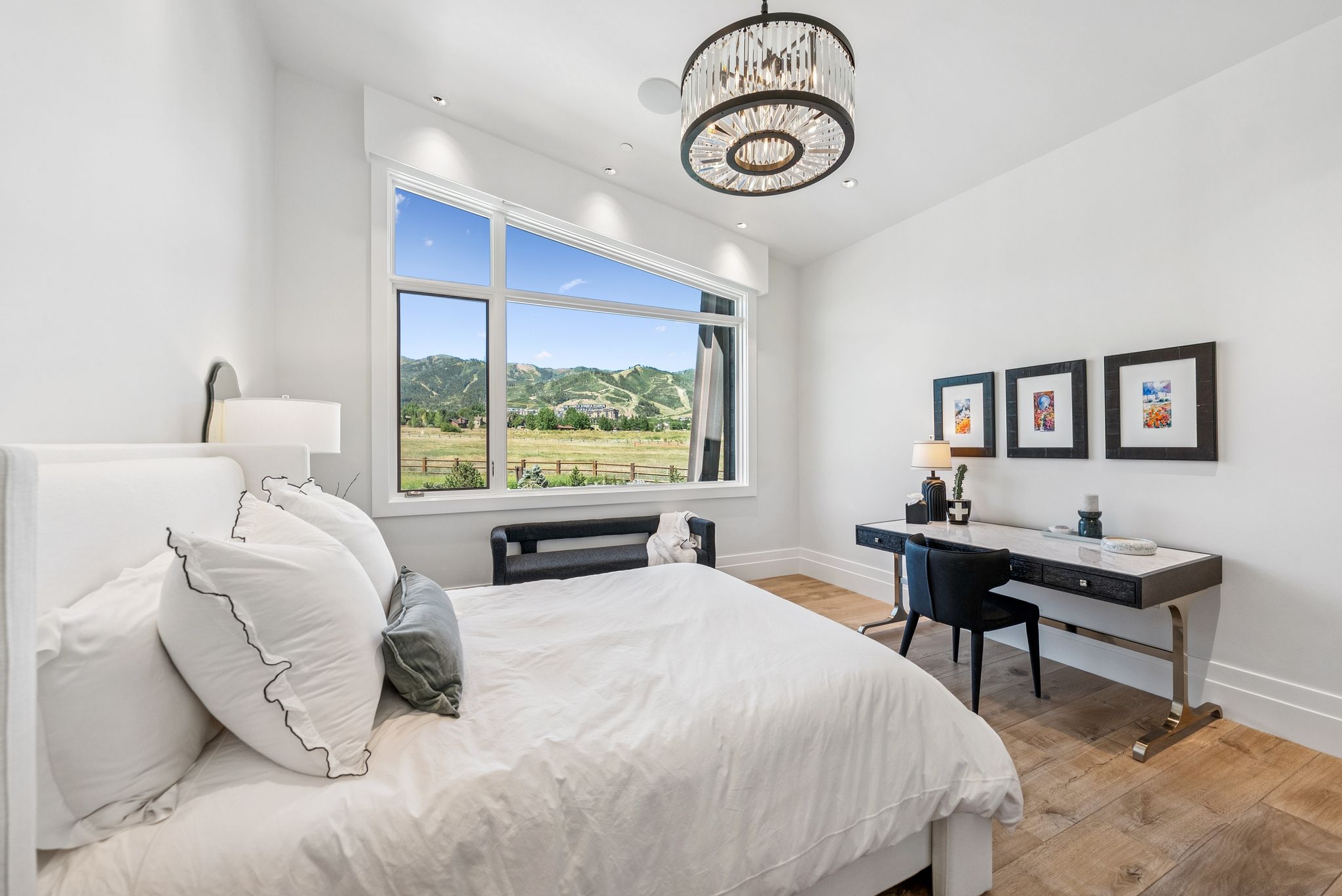 Bedroom with light wood-style floors, a chandelier, and recessed lighting