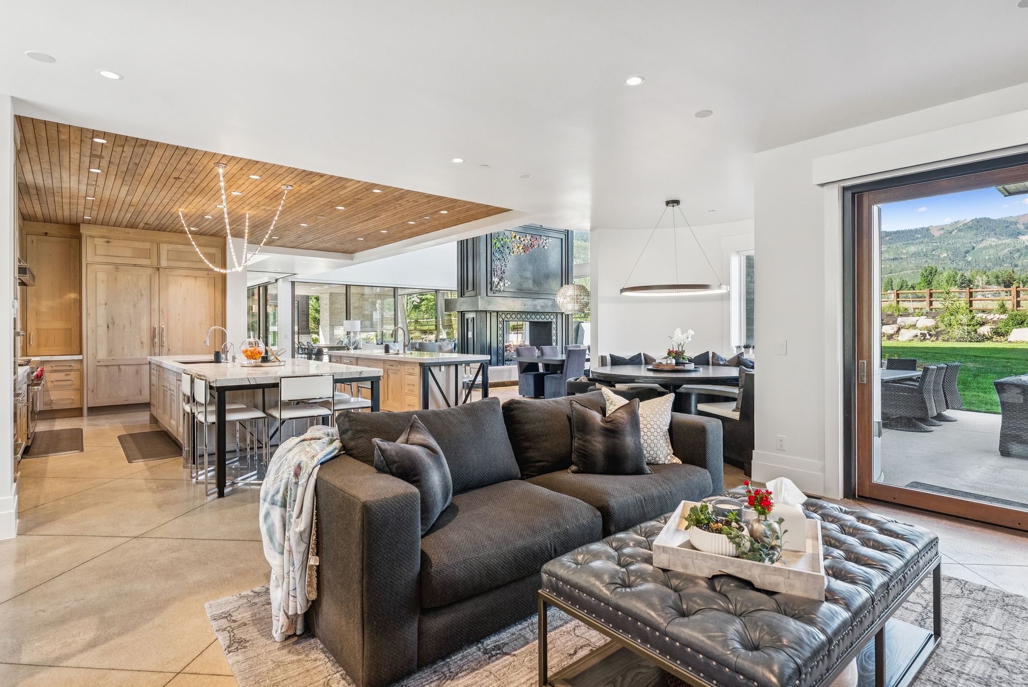 Living area featuring wooden ceiling, plenty of natural light, and recessed lighting