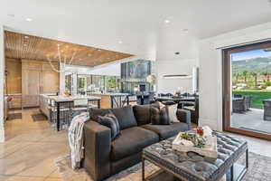 Living area featuring wooden ceiling, plenty of natural light, and recessed lighting