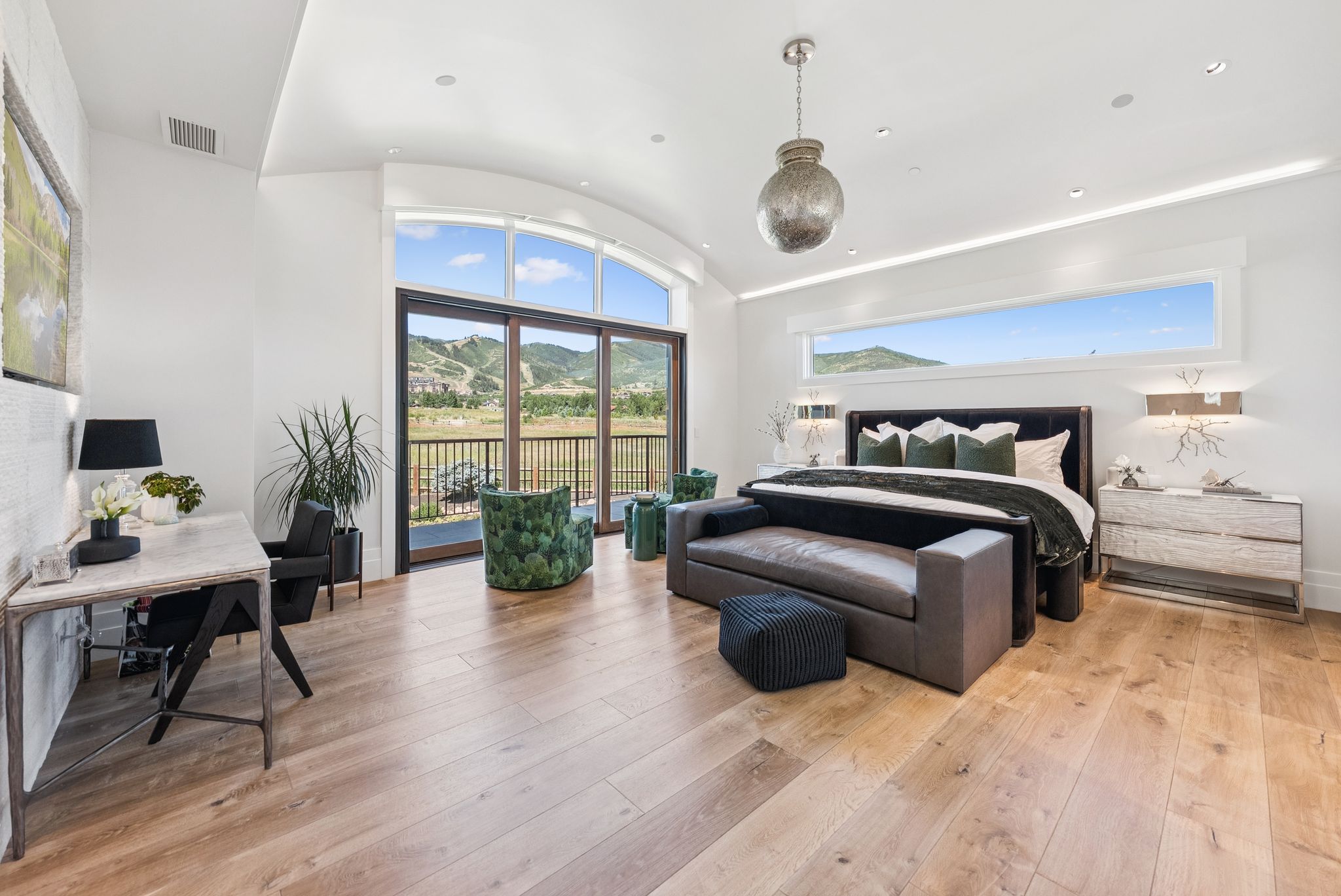 Bedroom with access to exterior, light wood-style flooring, vaulted ceiling, an office area, and recessed lighting