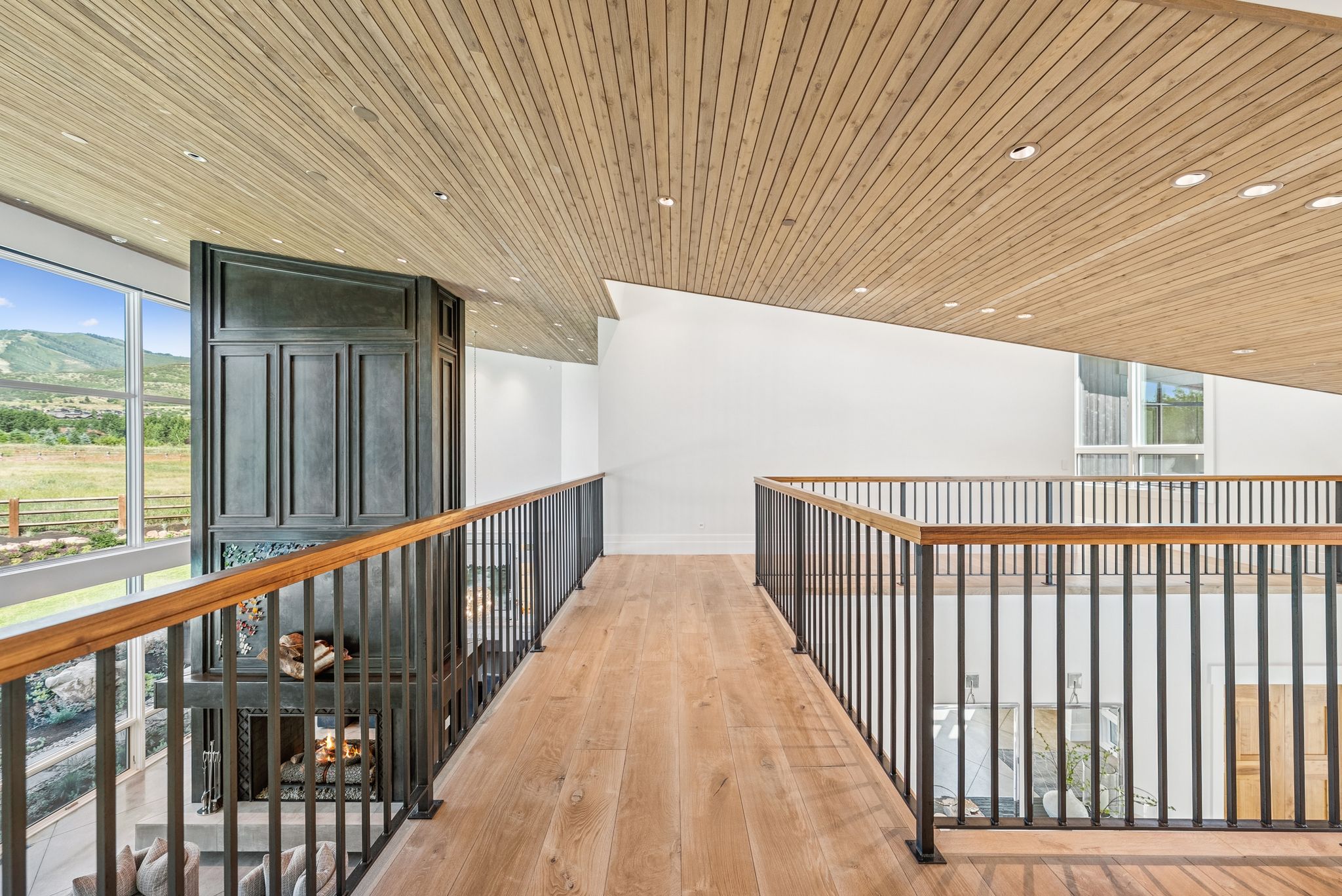 Corridor featuring wooden ceiling, light wood-style floors, and recessed lighting