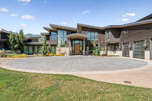 View of building exterior featuring driveway