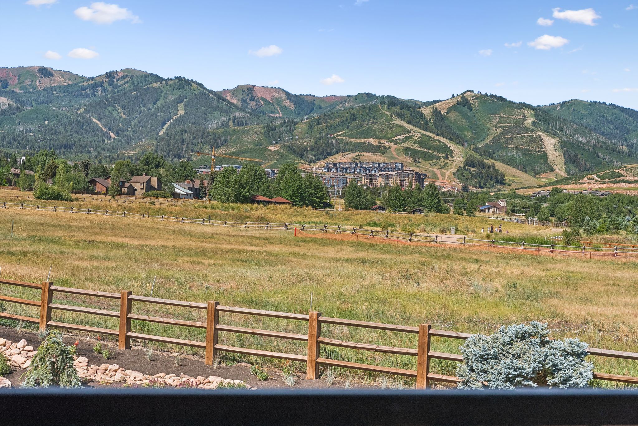 View of mountain backdrop with rural landscape and a pastoral area