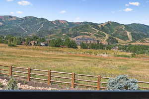 View of mountain backdrop with rural landscape and a pastoral area