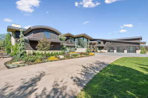 View of property with concrete driveway