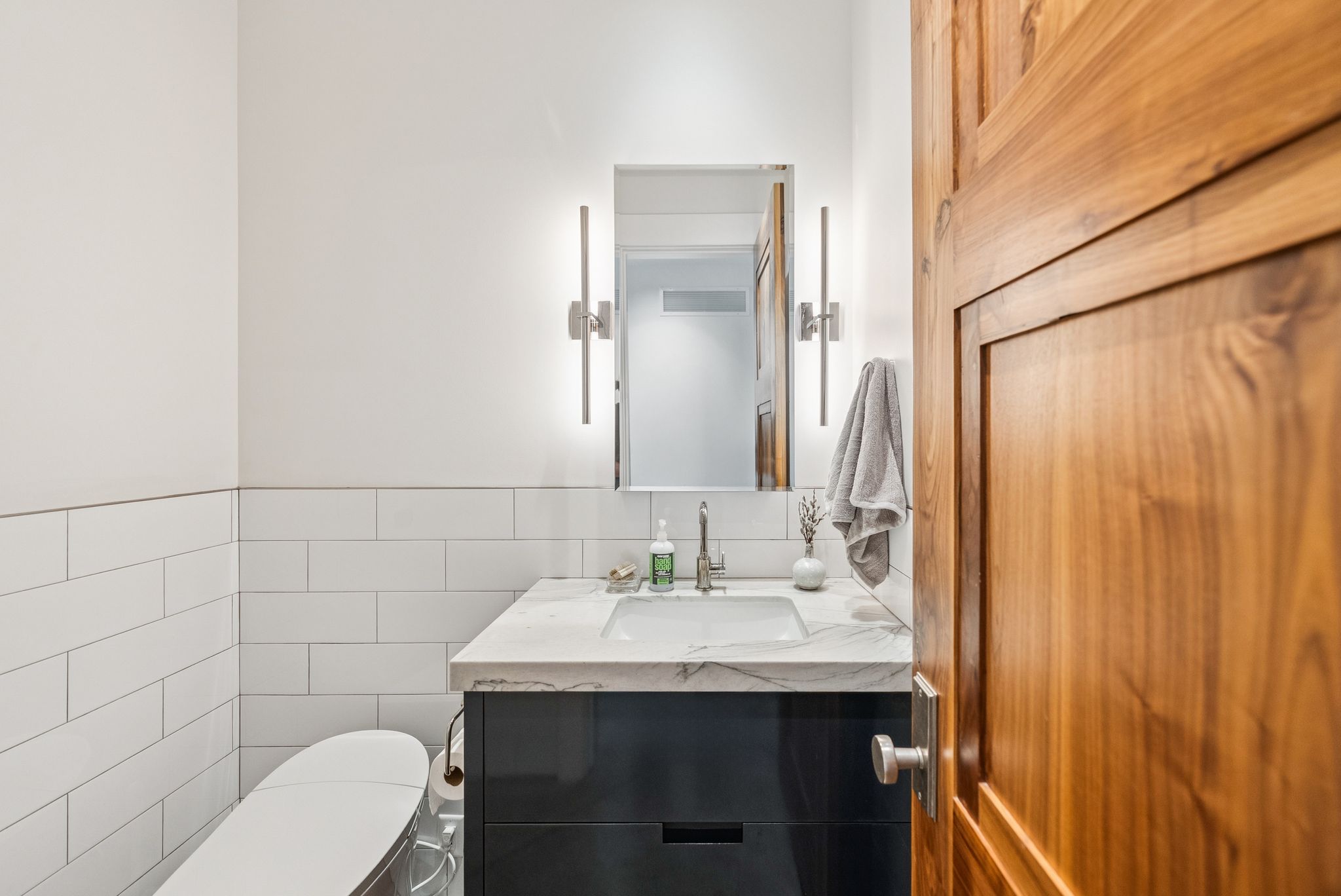 Bathroom with tile walls and vanity