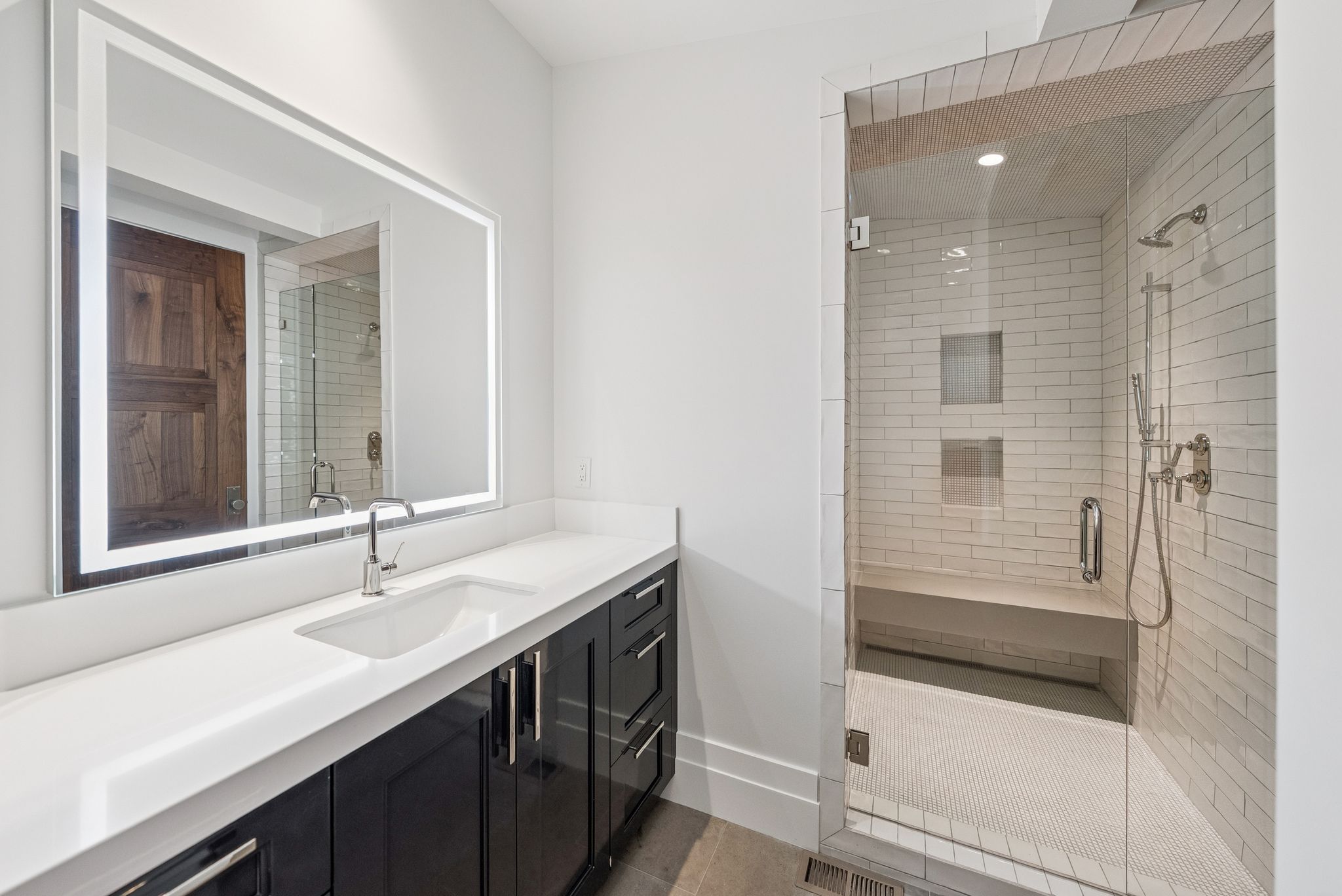 Full bath featuring vanity, a shower stall, and tile patterned floors