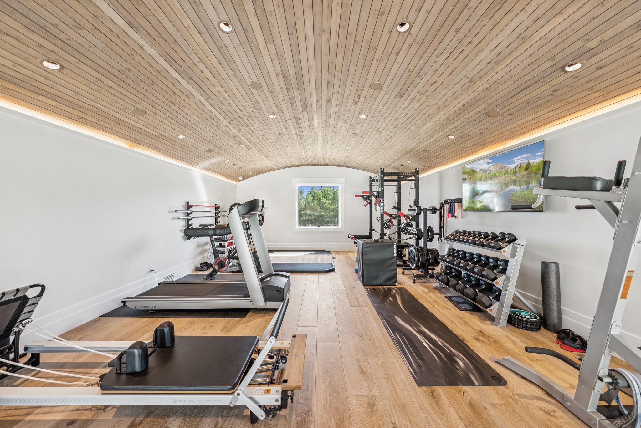 Exercise room with vaulted ceiling, recessed lighting, wood-type flooring, and wood ceiling