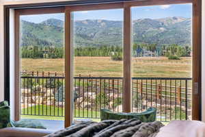 Doorway featuring a mountain view and plenty of natural light