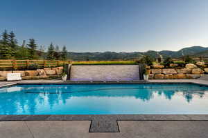 Outdoor pool with a mountain view