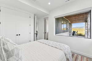 Bedroom with a closet and recessed lighting