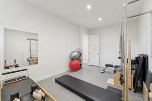 Workout area featuring recessed lighting and baseboards