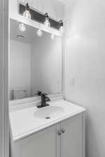 Bathroom with vanity and toilet