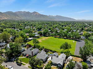 Aerial view of residential area featuring a mountain backdrop
