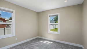 Unfurnished room featuring carpet floors and recessed lighting