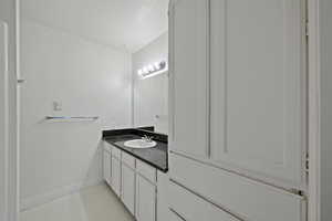 Bathroom with baseboards and vanity