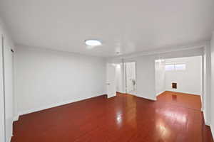 Basement featuring wood finished floors and baseboards