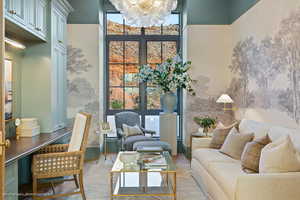 Living room featuring a chandelier and wood finished floors