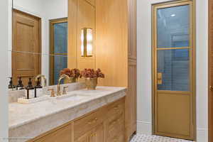 Bathroom with vanity and baseboards