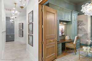 Office featuring a chandelier and light tile patterned flooring