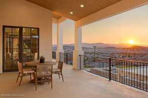 Patio / terrace featuring a mountain view and outdoor dining space