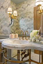 Bathroom view of wallpapered walls