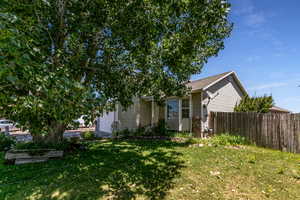 View of front of house with an attached garage and roof with shingles