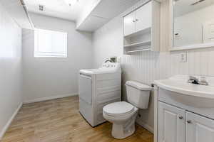 Laundry room with a half bath.