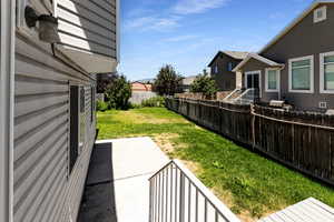 Fenced backyard with a patio