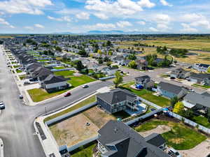 Aerial view of residential area featuring a mountain backdrop