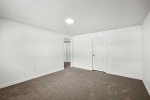 Unfurnished bedroom with carpet floors and a closet