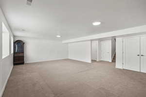 Finished basement featuring carpet flooring and recessed lighting
