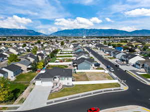 Aerial perspective of suburban area featuring a mountain backdrop