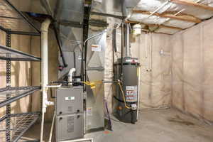 Utilities featuring gas water heater and heating unit
