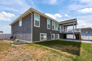 Back of house featuring a patio, stucco siding, a deck, and stairs