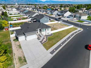 Aerial perspective of suburban area featuring a mountainous background