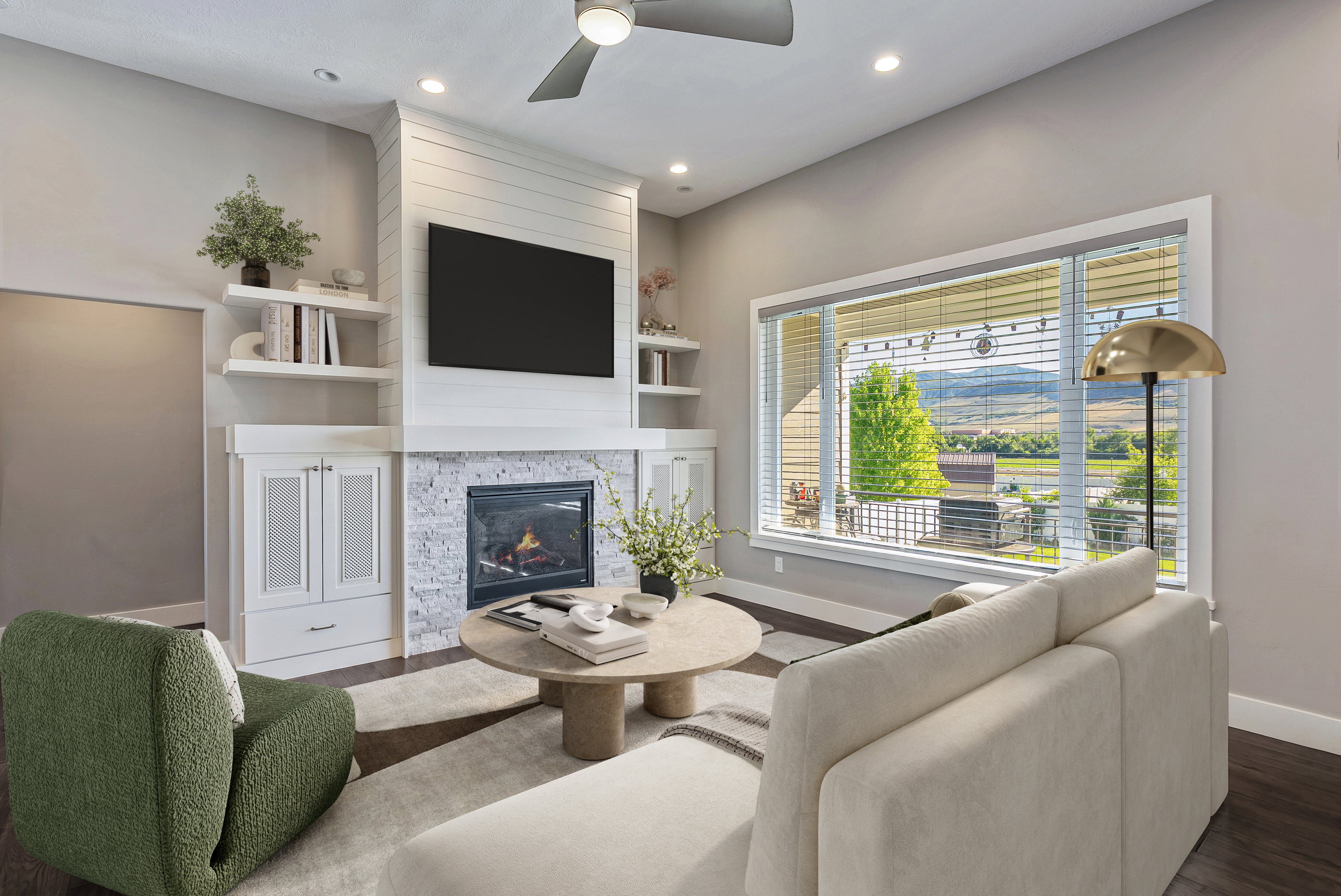 Living area featuring a floor-to-ceiling fireplace with stone surround and shiplap accents