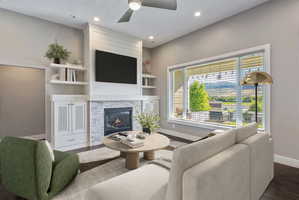 Living area featuring a floor-to-ceiling fireplace with stone surround and shiplap accents