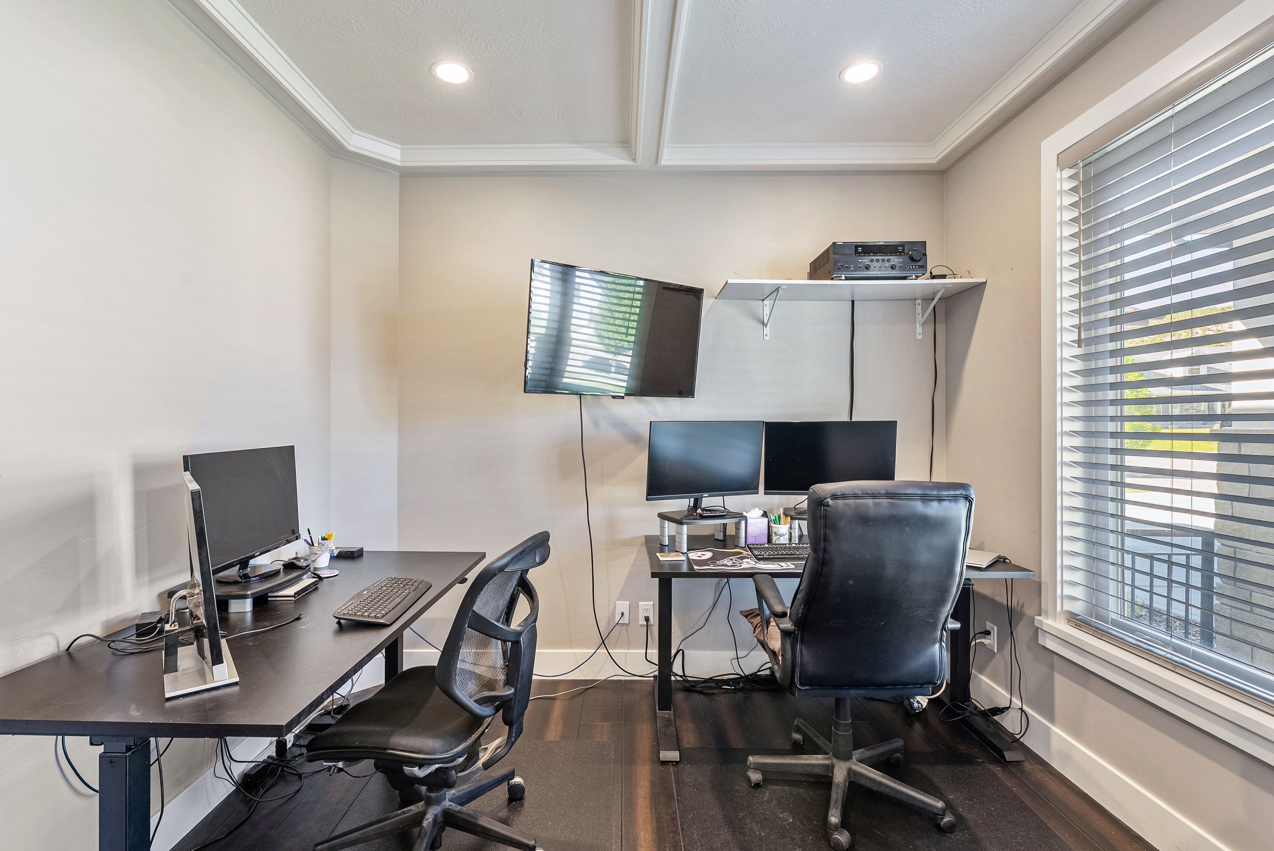 Dedicated room featuring wood-finish flooring, recessed lighting, and crown molding