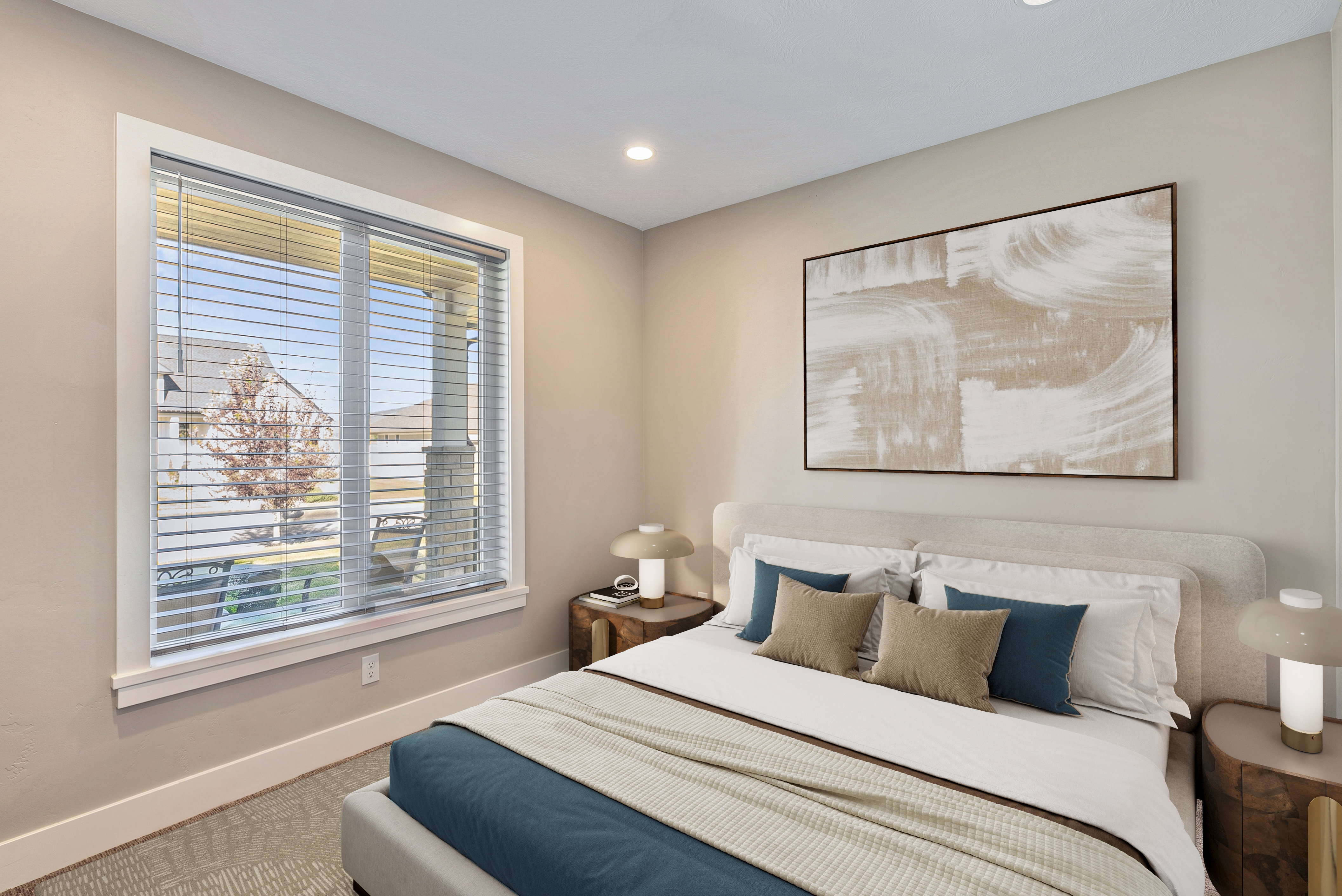 Recessed lighting illuminating the neutral-toned walls and textured carpeting